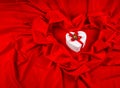 Love card with heart on a red fabric Royalty Free Stock Photo