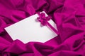 Love card with heart and ribbon on a purple fabric Royalty Free Stock Photo