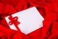 Love card with ribbon on a red fabric Royalty Free Stock Photo