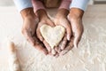 Black man and girl holding dough in heart shape Royalty Free Stock Photo