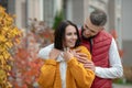 Positive young man hugging his beloved girlfriend Royalty Free Stock Photo