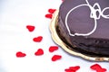Love chocolate: sacher torte on white with red hearts Royalty Free Stock Photo