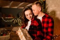 Love, christmas, couple, proposal and people concept - happy man giving diamond engagement ring to woman at home Royalty Free Stock Photo