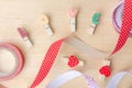 Love clips with cute ribbons on wooden background Royalty Free Stock Photo