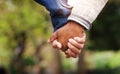 Love, closeup senior couple holding hands and in a park nature background. Support or care, bonding or quality time and Royalty Free Stock Photo