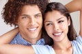So in love. Closeup studio shot of a happy young ethnic couple holding each other and smiling. Royalty Free Stock Photo