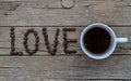 LOVE coffee beans on wooden background