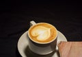 Love coffee,A cup of latte art with heart pattern in a white cup.Indoor cafe Royalty Free Stock Photo