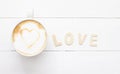 Love coffee cup of latte art with heartin white cup, romantic for valentine's Day  on wood background Royalty Free Stock Photo