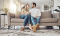 Love, comfy and couple on the sofa to relax with a smile and gratitude in living room. Happiness, laughing and happy man Royalty Free Stock Photo