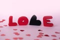 Love composition on pink background. Valentines day greeting card with love word