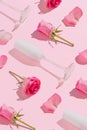 Love composition with white champagne glasses, roses and flower petals against light pink background. Minimal Mother`s Day or Royalty Free Stock Photo