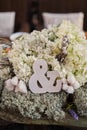 Love concept of ampersand sign to symbolise relationship wedding decoration, ampersand symbol in a flower arrangement