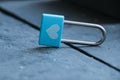 Love concept. Blue padlock with a heart on a vintage table Royalty Free Stock Photo