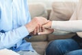 Happy elderly couple holding hands at home Royalty Free Stock Photo