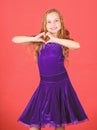 Love concept. Girl cute child show heart shaped hand gesture. Symbol of love. Kid adorable girl with long hair smiling Royalty Free Stock Photo