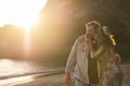 Love concept with happy adult caucasian couple kissing and hugging with joy in outdoor leisure activity at the beach during summer Royalty Free Stock Photo