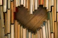 Love concept of heart shape from old vintage books on wooden flo