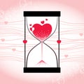 Love concept with hourglass and decreasing sand on the striped pink background