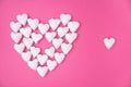 Love concept idea with big heart made from small white hearts on pink background. Minimal flat lay Royalty Free Stock Photo