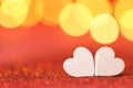 Love .Valentine's Day. Love symbol. two white hearts on a red glitter background with gold bokeh. Valentines day Royalty Free Stock Photo