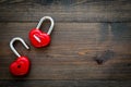 Love concept. Valentine`s day symbol. Locks in shape of heart o dark wooden background top view copy space Royalty Free Stock Photo