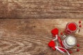 Love concept for Valentines day or mothers day. Red felt heart, glass jar, roses, ribbons. Old wooden boards background Royalty Free Stock Photo