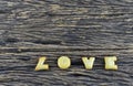 Love cookies alphabet on wooden background