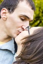 Love couple closeup kissing looking happy