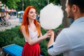 Love couple with cotton candy in summer park Royalty Free Stock Photo