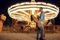 Love couple dancing in night amusement park Royalty Free Stock Photo