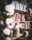 Love couple figurines on a shelf with the words love
