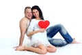 Love couple on the floor with a big red heart Royalty Free Stock Photo