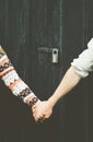 Love Couple hands holding forever together Lifestyle wooden background and lock over people taboo