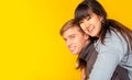 In love Couple. Happiness couple get happiness when they stay together with smiley faces. Asian girlfriend ride on her boyfriend b Royalty Free Stock Photo