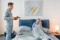 Love couple having romantic breakfast in bed Royalty Free Stock Photo