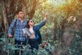 Love couple hiking trail and trekking in the forest with friends. Walk Through Countryside and read the map. Royalty Free Stock Photo