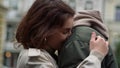 Happy couple hugging on urban street. Man and woman enjoying romantic date. Royalty Free Stock Photo