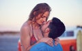 Love, couple and kiss at the beach on date, vacation or road trip in summer with freedom, together and romantic Royalty Free Stock Photo