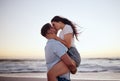 Love, couple and kiss on beach at sunset for romantic and passionate embrace on summer evening date. Dating USA woman Royalty Free Stock Photo