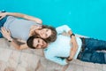 Love couple lying near swimming pool Royalty Free Stock Photo