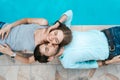Love couple lying near swimming pool Royalty Free Stock Photo