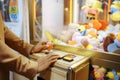 Love couple playing game machine, amusement park Royalty Free Stock Photo