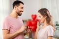 Man giving woman engagement ring on valentines day Royalty Free Stock Photo