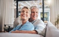 Love, couple and retirement with a senior woman and man on a sofa to relax in their home together. Happy, smile and Royalty Free Stock Photo