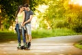 Love couple ride rollerblades in the park Royalty Free Stock Photo