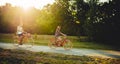 Love couple riding on vintage bicycles in park
