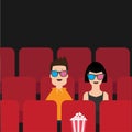 Love couple sitting in movie theater. Film show Cinema background. Viewers watching movie in 3D glasses. Popcorn box on red seat. Royalty Free Stock Photo