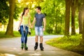 Love couple spending free time together on roller Royalty Free Stock Photo