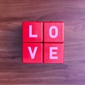 Love: Cubes with letters on cherry wood